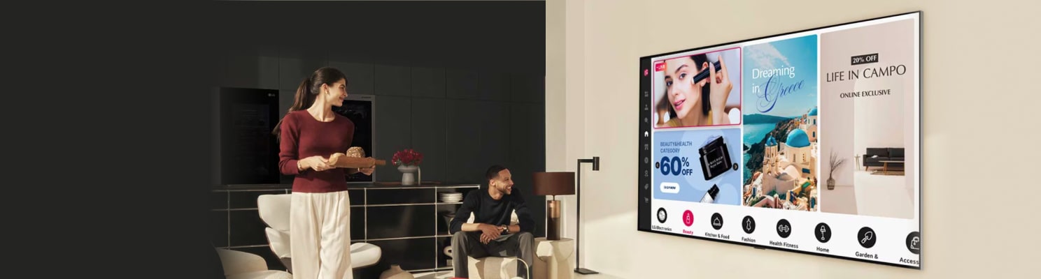 A couple in a modern living room online shopping via an LG TV.